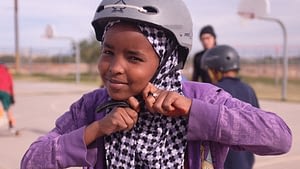 Image: Young girl clicking in her helmet