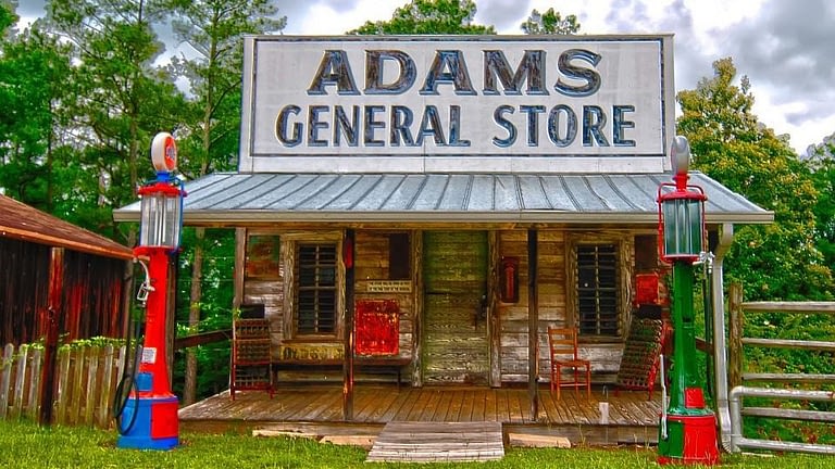Image: A small building with a large sign reading "Adam's General Store"