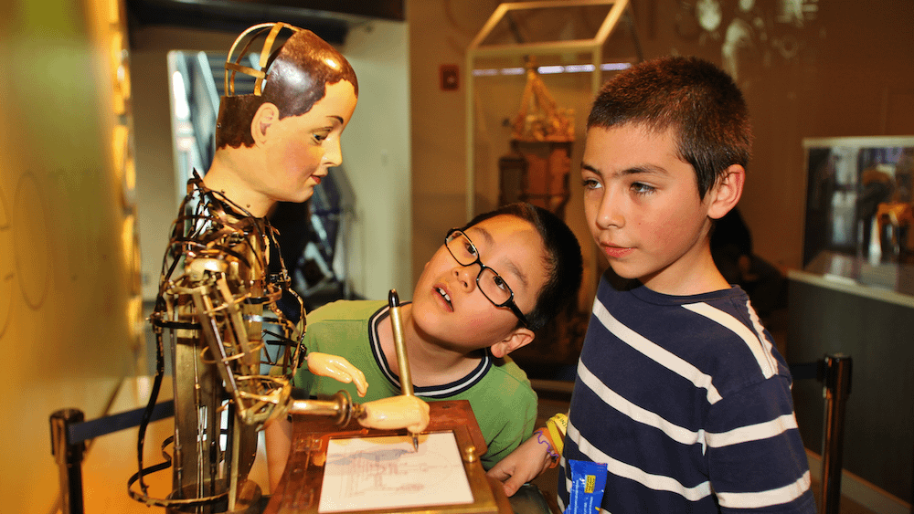 Image: Children staring at one of the most famous automatons at the Franklin Institute