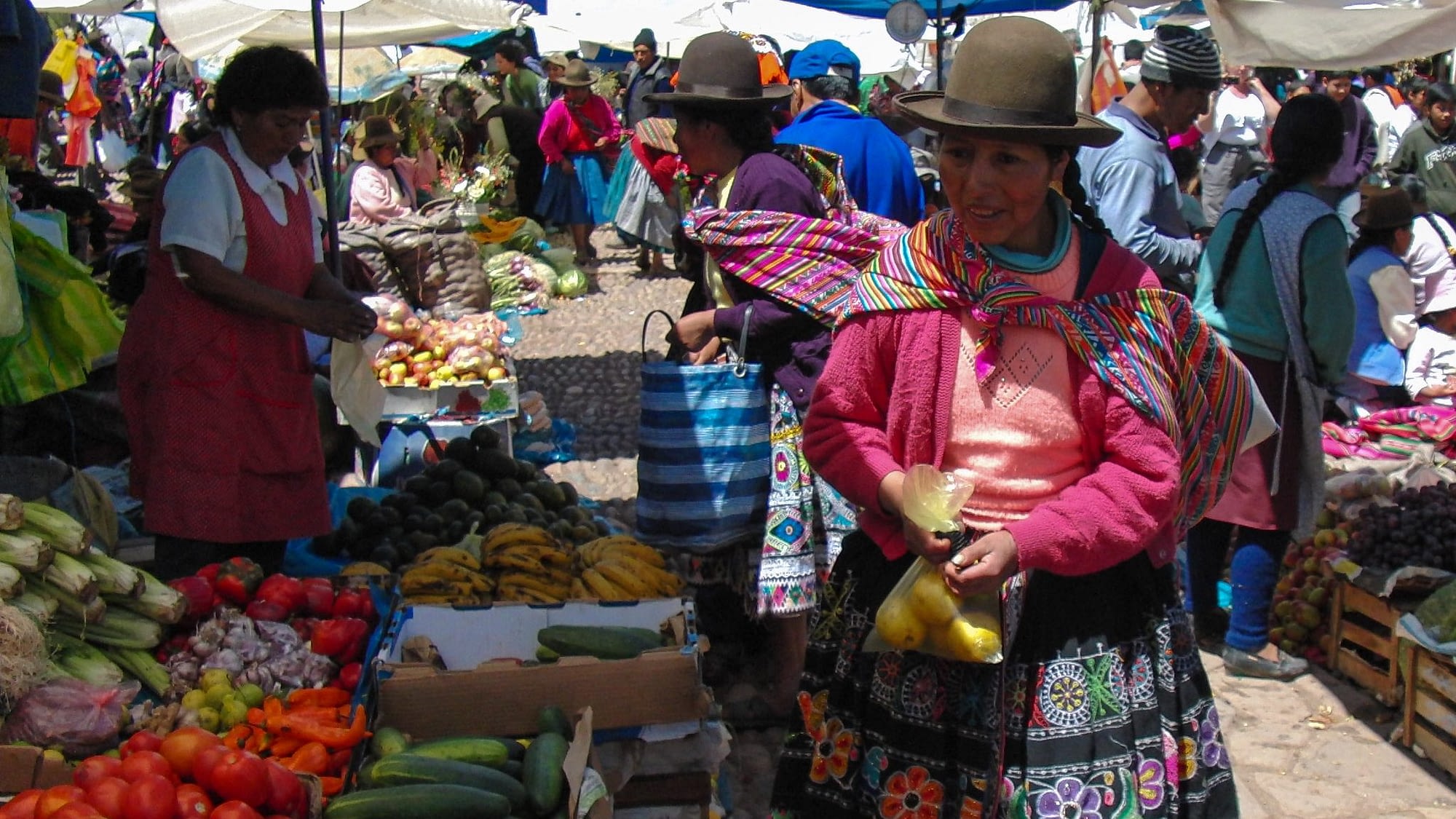 Image: Woman in Peru buying food at a market