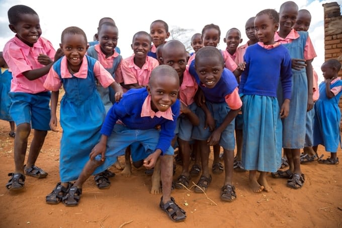 Image: Group of school children wearing the shoe that grows
