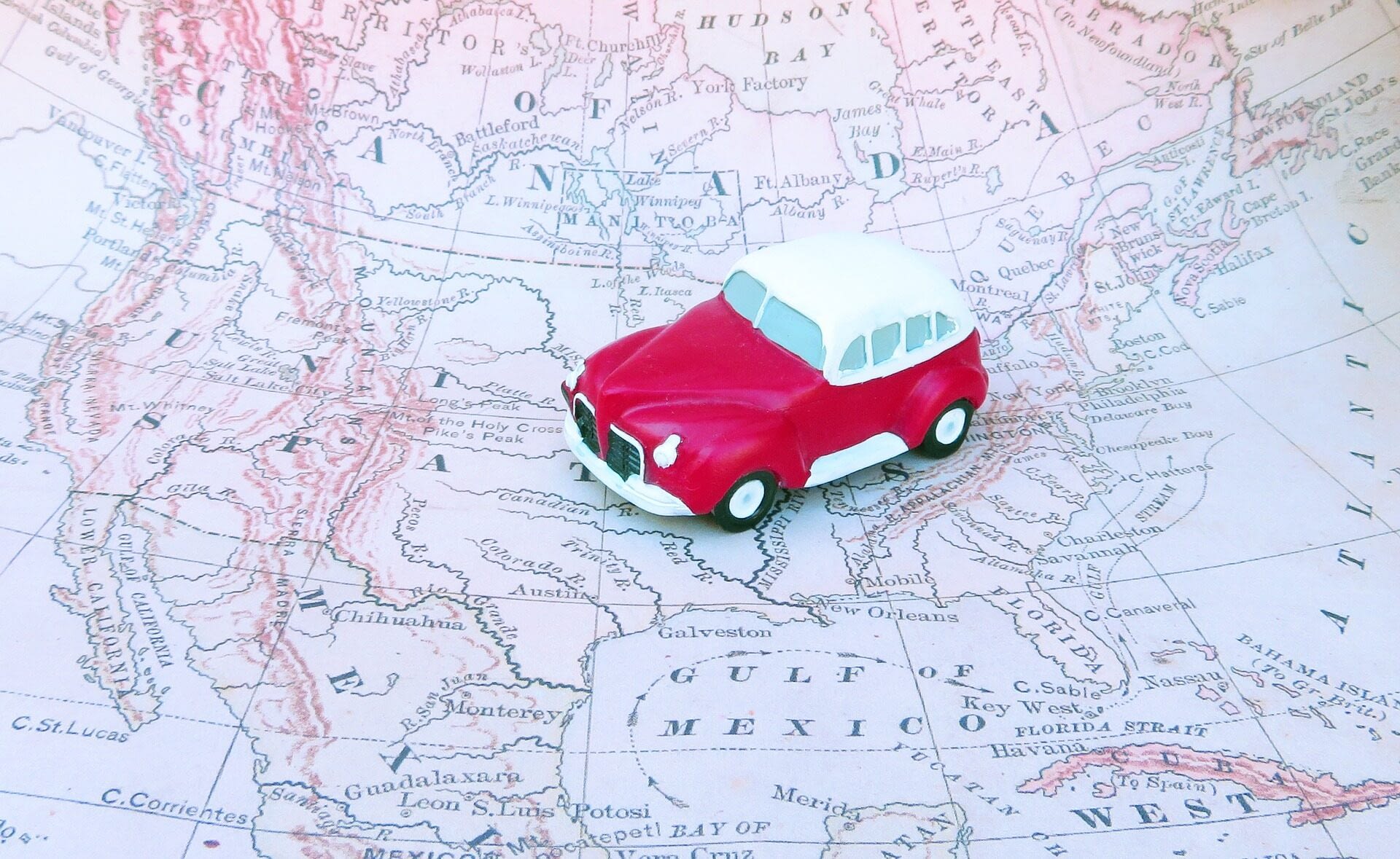 Image: toy car on top of a map of the united states